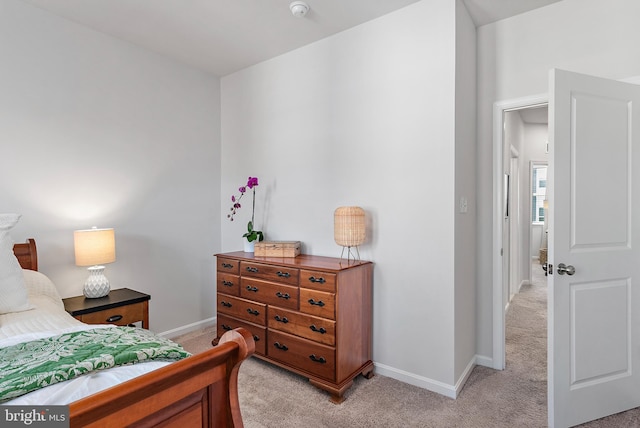 bedroom with light colored carpet