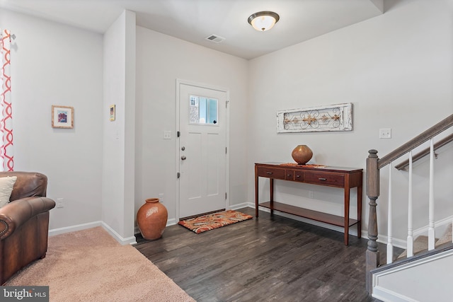 foyer with dark hardwood / wood-style flooring