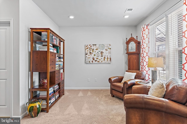 sitting room with light colored carpet