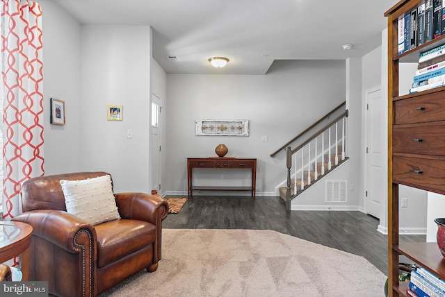 sitting room featuring dark hardwood / wood-style flooring