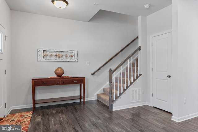 foyer with dark hardwood / wood-style flooring