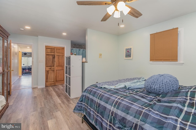 bedroom featuring ceiling fan and light wood-type flooring