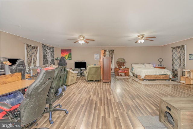 bedroom featuring ceiling fan and light hardwood / wood-style floors