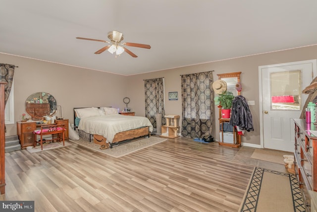 bedroom featuring light hardwood / wood-style flooring and ceiling fan