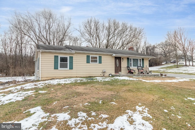 view of front of house with a yard