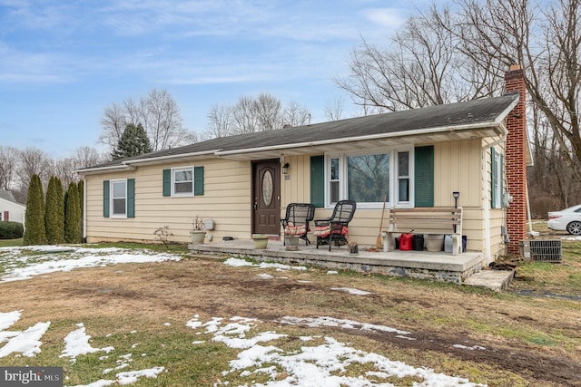 ranch-style home featuring central AC unit