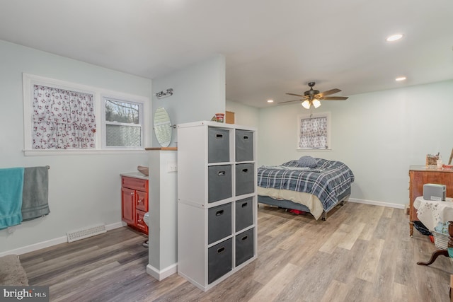 bedroom featuring wood-type flooring and ceiling fan