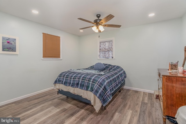 bedroom featuring hardwood / wood-style floors and ceiling fan