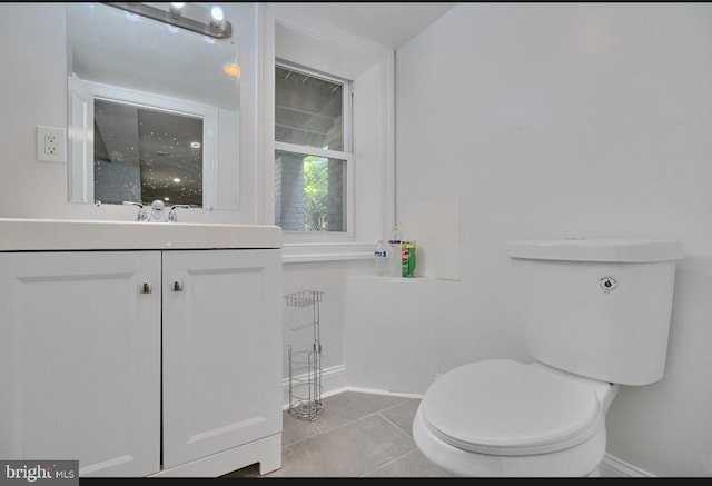 bathroom with tile patterned floors, toilet, and vanity