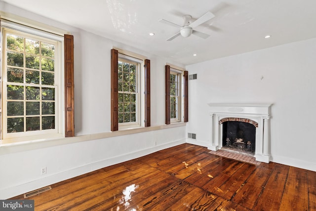 unfurnished living room with hardwood / wood-style floors and ceiling fan