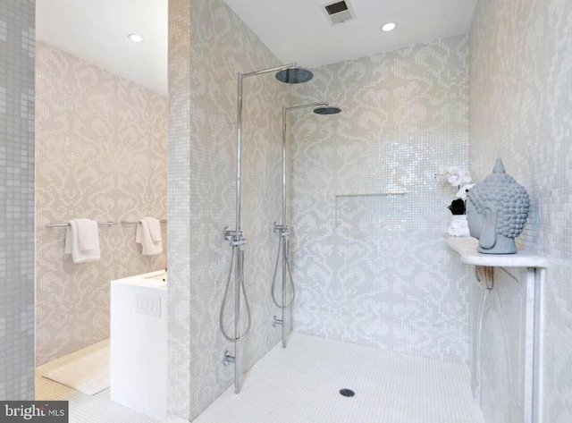 bathroom with tiled shower