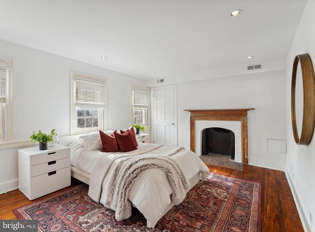 bedroom with hardwood / wood-style floors