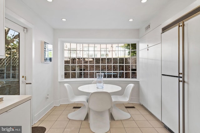 tiled dining space with plenty of natural light