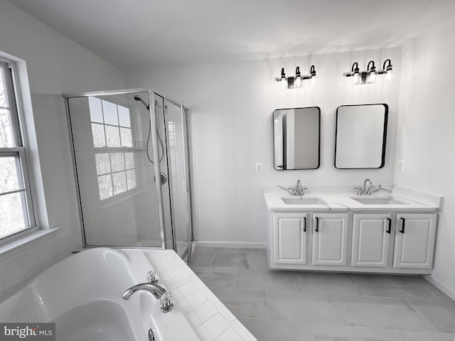 bathroom featuring vanity, tile patterned floors, and plus walk in shower