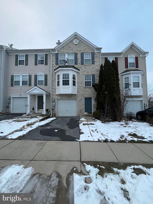 multi unit property featuring a garage