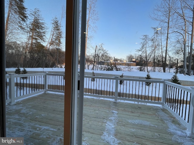 view of snow covered deck