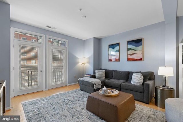 living room with light hardwood / wood-style floors