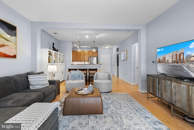 living room featuring light wood-type flooring