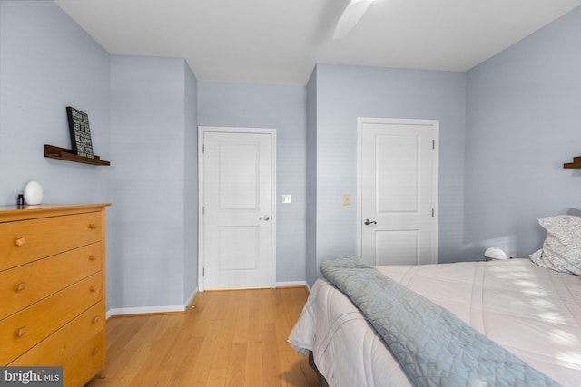 bedroom featuring ceiling fan and light hardwood / wood-style flooring