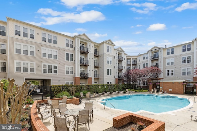 view of swimming pool with a patio area