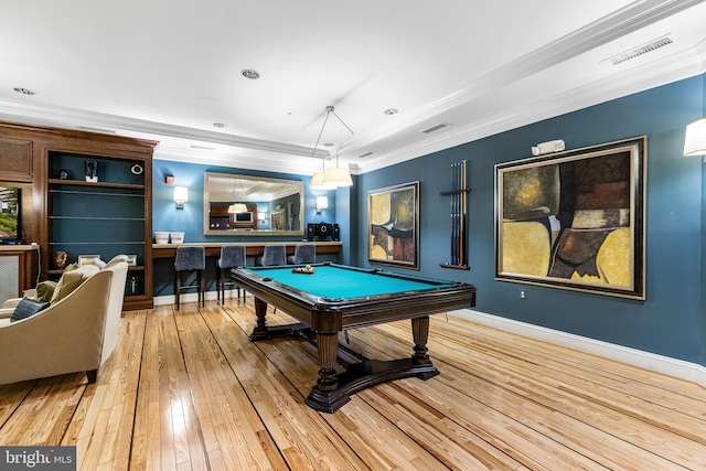 playroom featuring ornamental molding, built in features, light hardwood / wood-style floors, and billiards