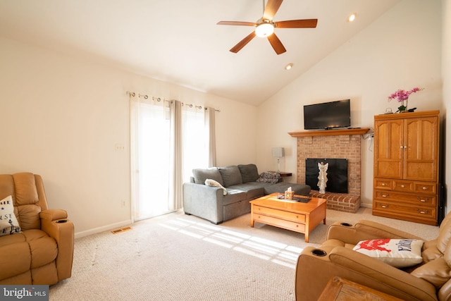 living room featuring light carpet, a brick fireplace, high vaulted ceiling, and ceiling fan