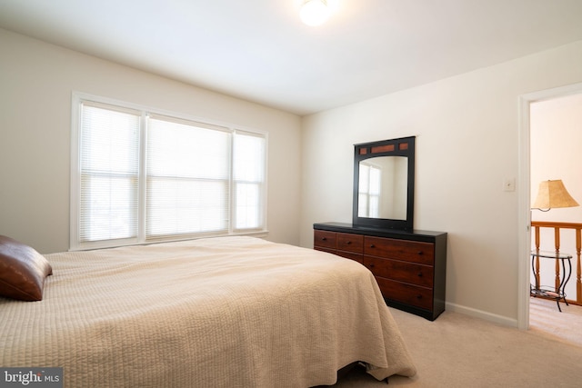 bedroom with light colored carpet