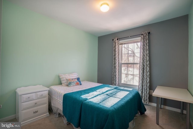 bedroom with light colored carpet