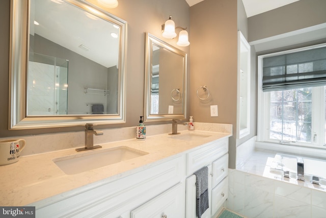 bathroom featuring vanity and vaulted ceiling