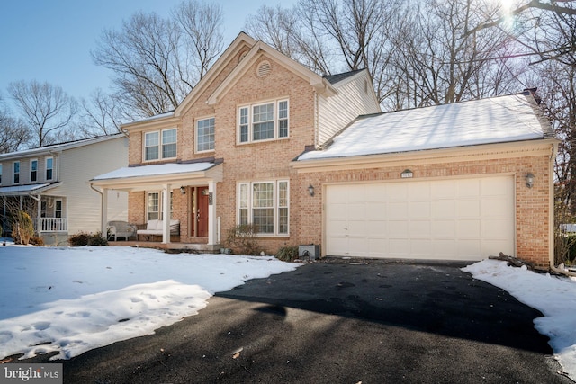 view of front of house featuring a garage and a porch