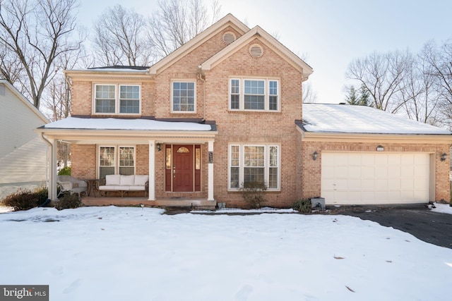 view of front of property with a porch and a garage