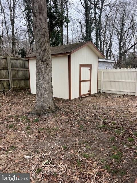 view of shed with a fenced backyard