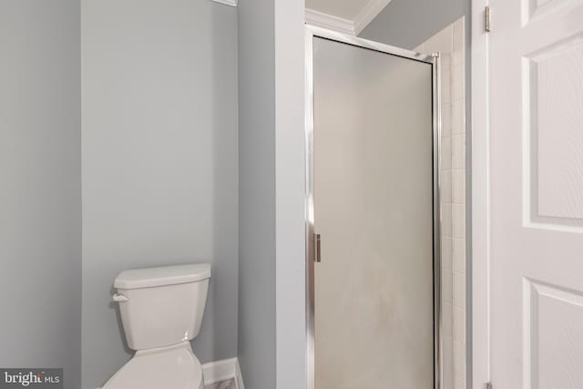 bathroom with toilet and walk in shower