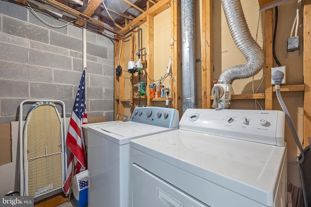 clothes washing area with independent washer and dryer