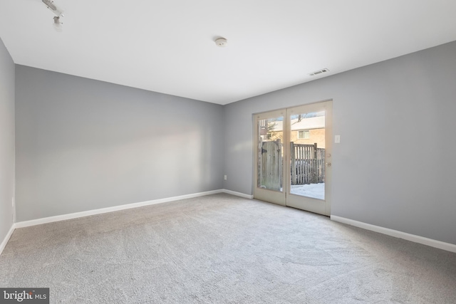 empty room with light colored carpet