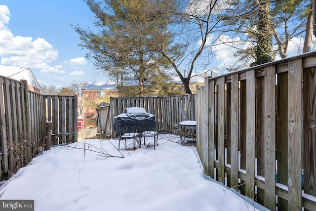 view of yard covered in snow