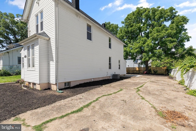 view of side of property with cooling unit