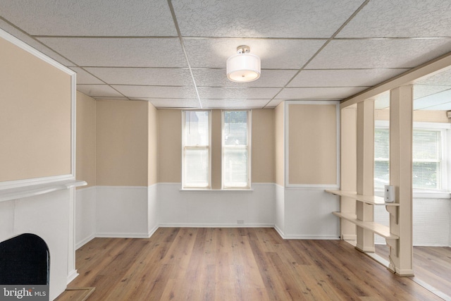 interior space featuring hardwood / wood-style floors and a paneled ceiling