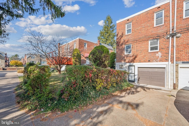 view of property exterior featuring a garage