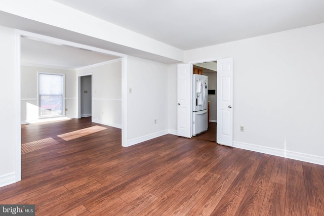 unfurnished room with dark hardwood / wood-style floors