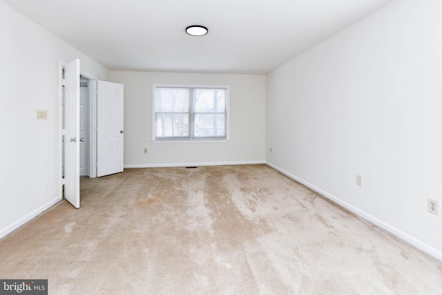 unfurnished bedroom with light colored carpet