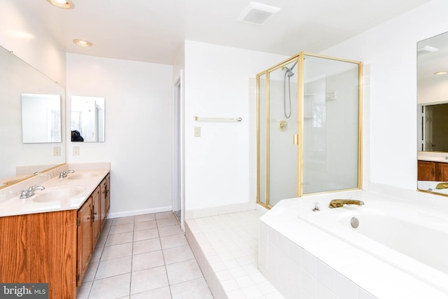 bathroom featuring vanity, tile patterned floors, and separate shower and tub