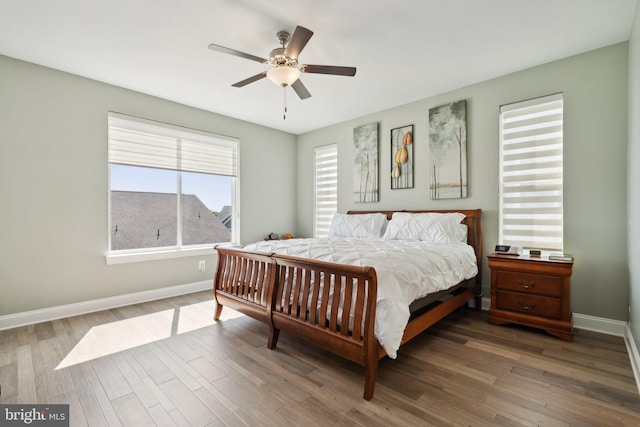 bedroom featuring ceiling fan and dark hardwood / wood-style floors