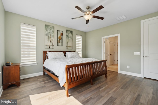 bedroom featuring dark hardwood / wood-style floors and ceiling fan