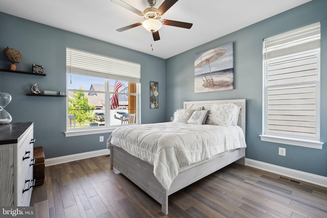 bedroom featuring ceiling fan and dark hardwood / wood-style flooring