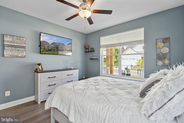 bedroom featuring dark wood-type flooring and ceiling fan