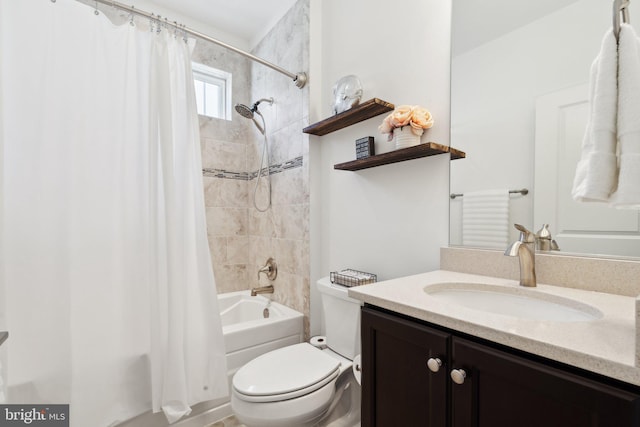 full bathroom featuring vanity, shower / tub combo, and toilet