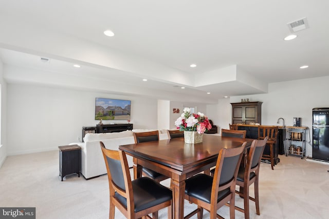 view of carpeted dining space