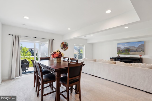 dining room featuring light colored carpet