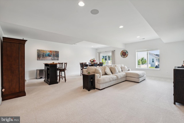 living room featuring light carpet